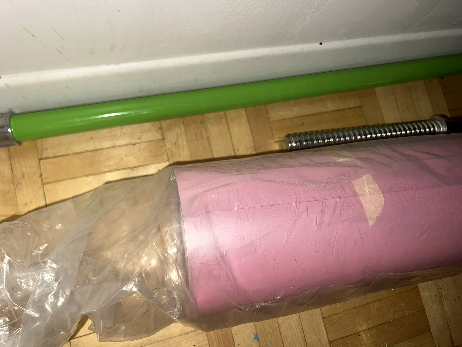Close-up of pink and green vinyl rolls